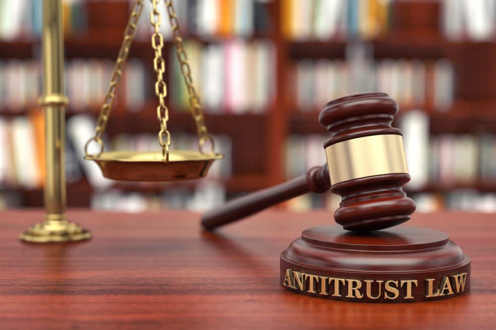Antitrust Law General A wooden hammer on which Antitrust Law is written