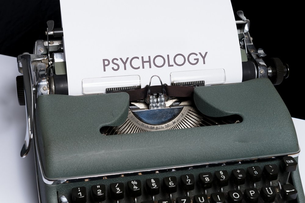 Typewriter with a paper in it that says Psychology on it.