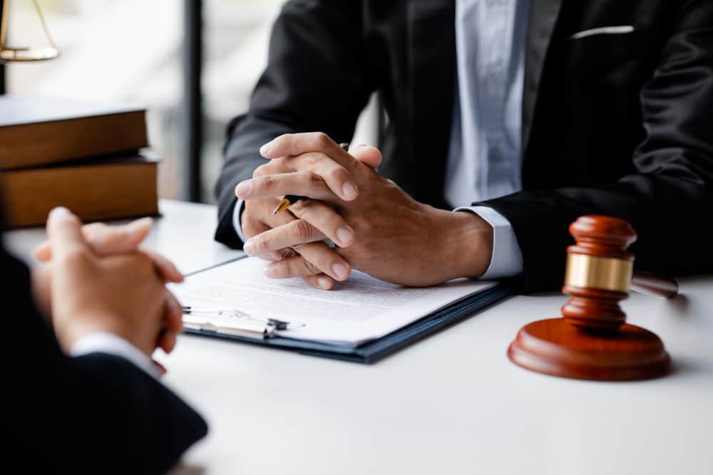 sue someone for legal disputes General A foreigner waiting to hear the final order to sue someone for legal disputes