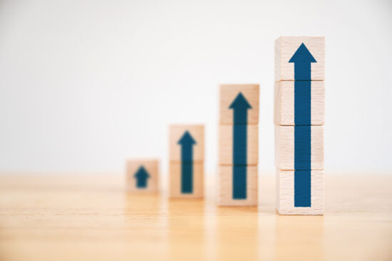 Ladder career path for business growth success process concept.Wood block stacking as step stair with arrow up