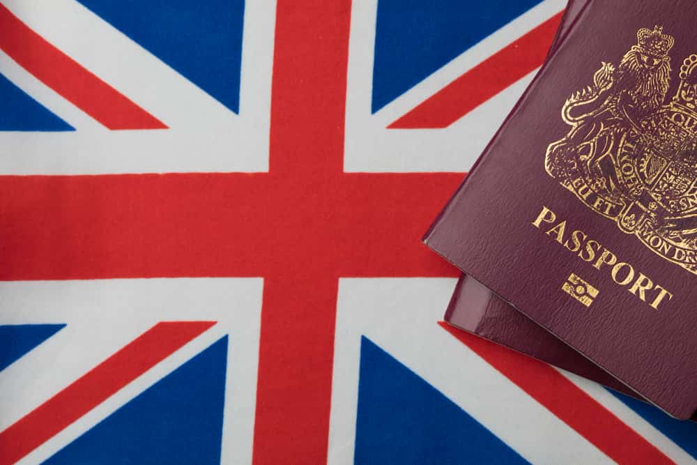 Immigrate from the US to UK Immigration Law A UK passport of an US immigrant ready to Immigrate from the US to UK