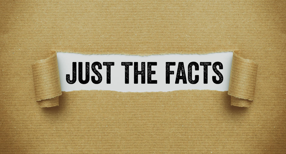 Torn brown paper revealing the words Just the facts