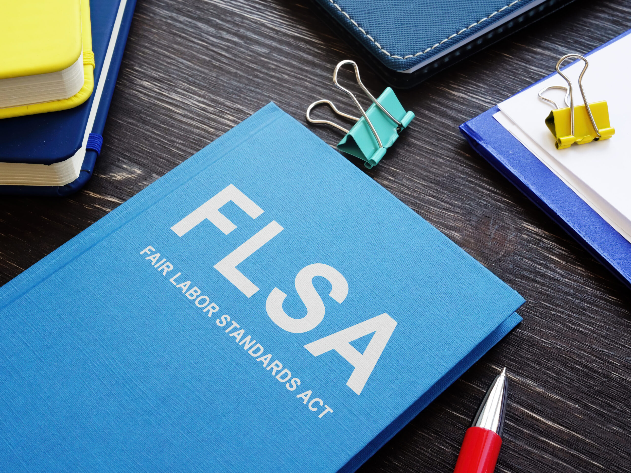 Blue book Fair Labor Standards Act FLSA in the office.
