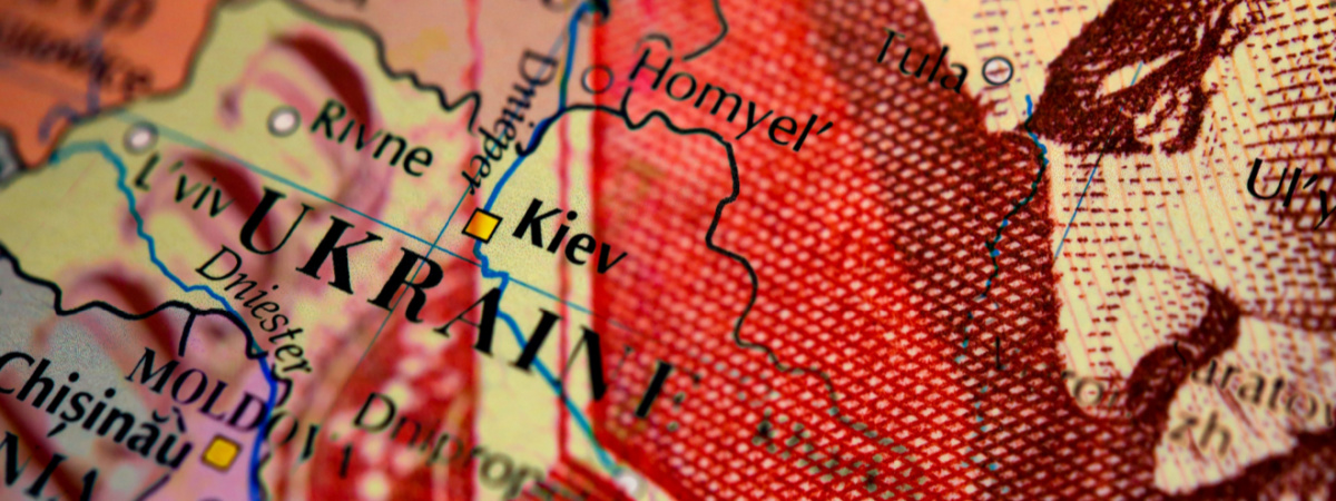 Close up of a Russian ruble banknote on top of a map of UkraineShutterstock_2098833952