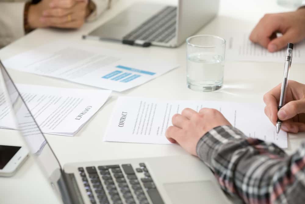 Insurance contracts for small businesses General A client signing Insurance contracts for small businesses following a consultation with Legamart Lawyers