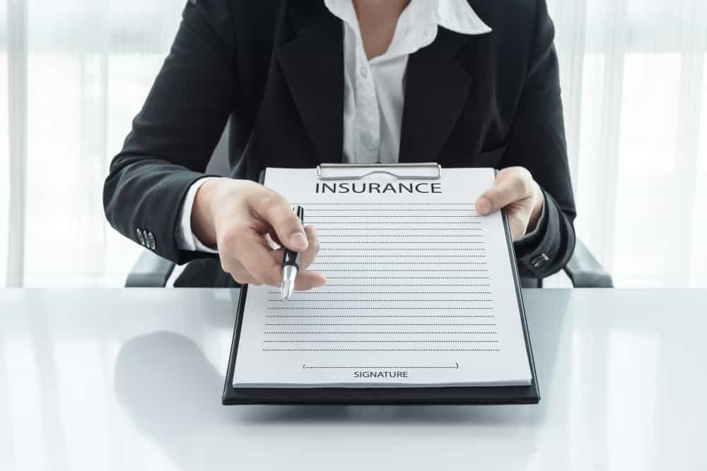 Insurance contracts for small businesses General An agent asking a client to sign Insurance contracts for small businesses