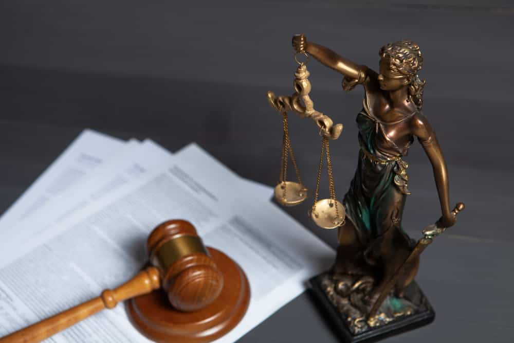 Director Liabilities Commercial and Business Law A lady of justice along with wooden hammer and papers on Director Liabilities