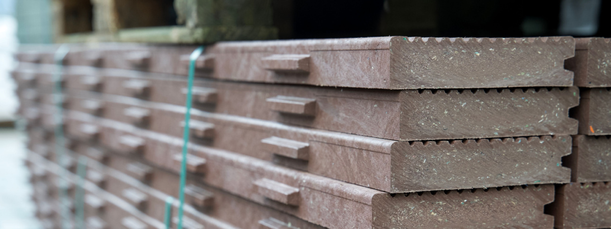 Pile of ribbed planks made from recycled plastic waste-Shutterstock_2093017921