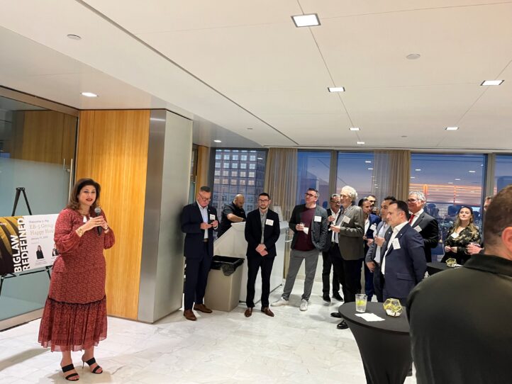 Greenberg Traurig's Kate Kalmykov addresses attendees of the conference.