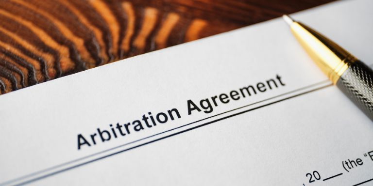 Arbitration-Agreement-Signing-Getty