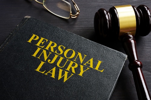 Black notebook with the title 'Personal Injury Law'