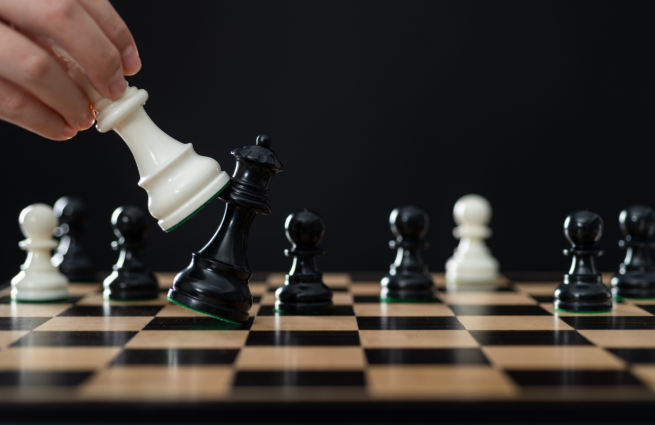Black chess queen is falling