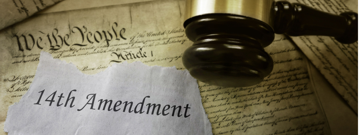 14th Amendment news headline on pages of the US Consitution-Shutterstock_1087824167