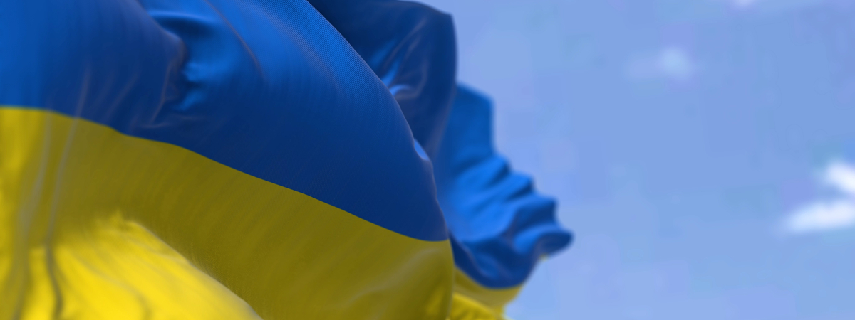 Detail of the national flag of Ukraine waving in the wind on a clear day. Democracy and politics. Eastern Europe country. Patriotism. Selective focus.-shutterstock_2113874450
