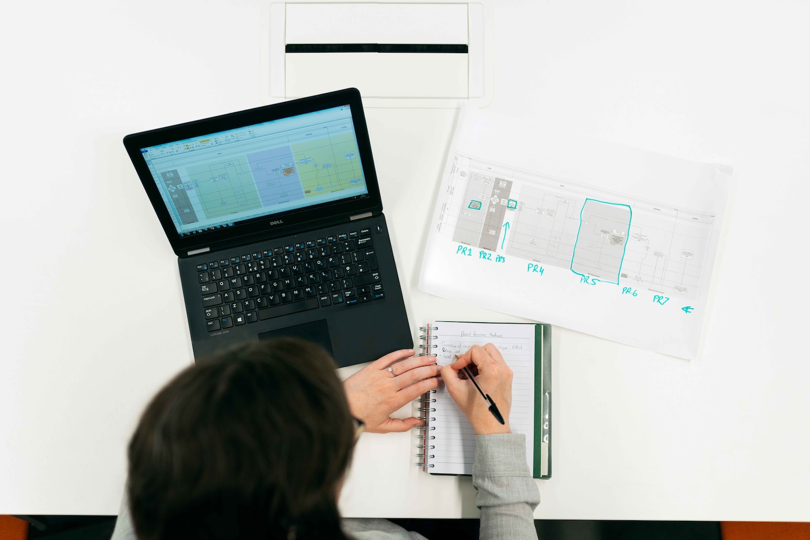 Female electronics engineer reviews data