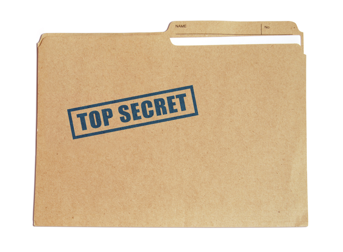 Brown card folder with top secret stamped on it in blue