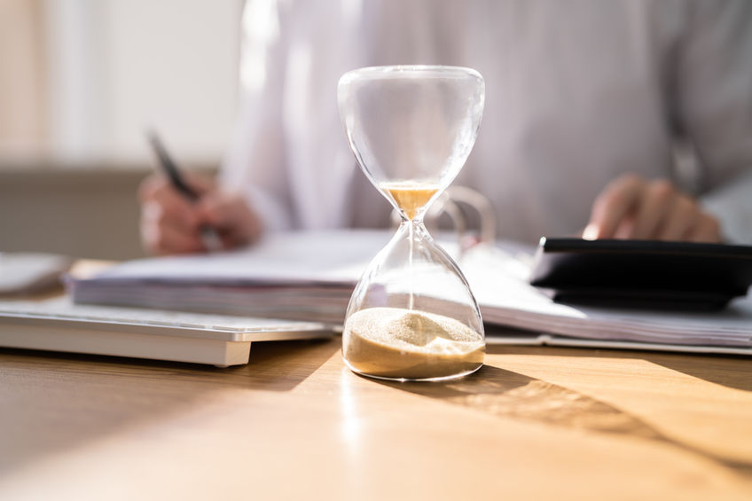 Accountant Calculating Invoice Bill In Time