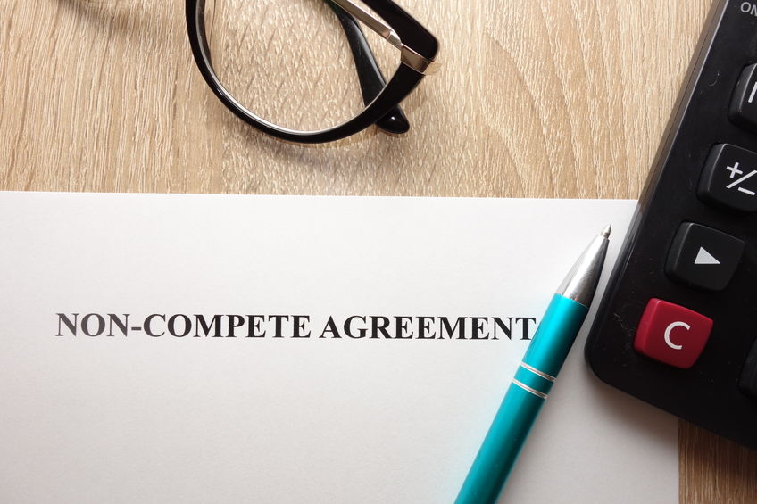 98080575 - non compete agreement form on desk