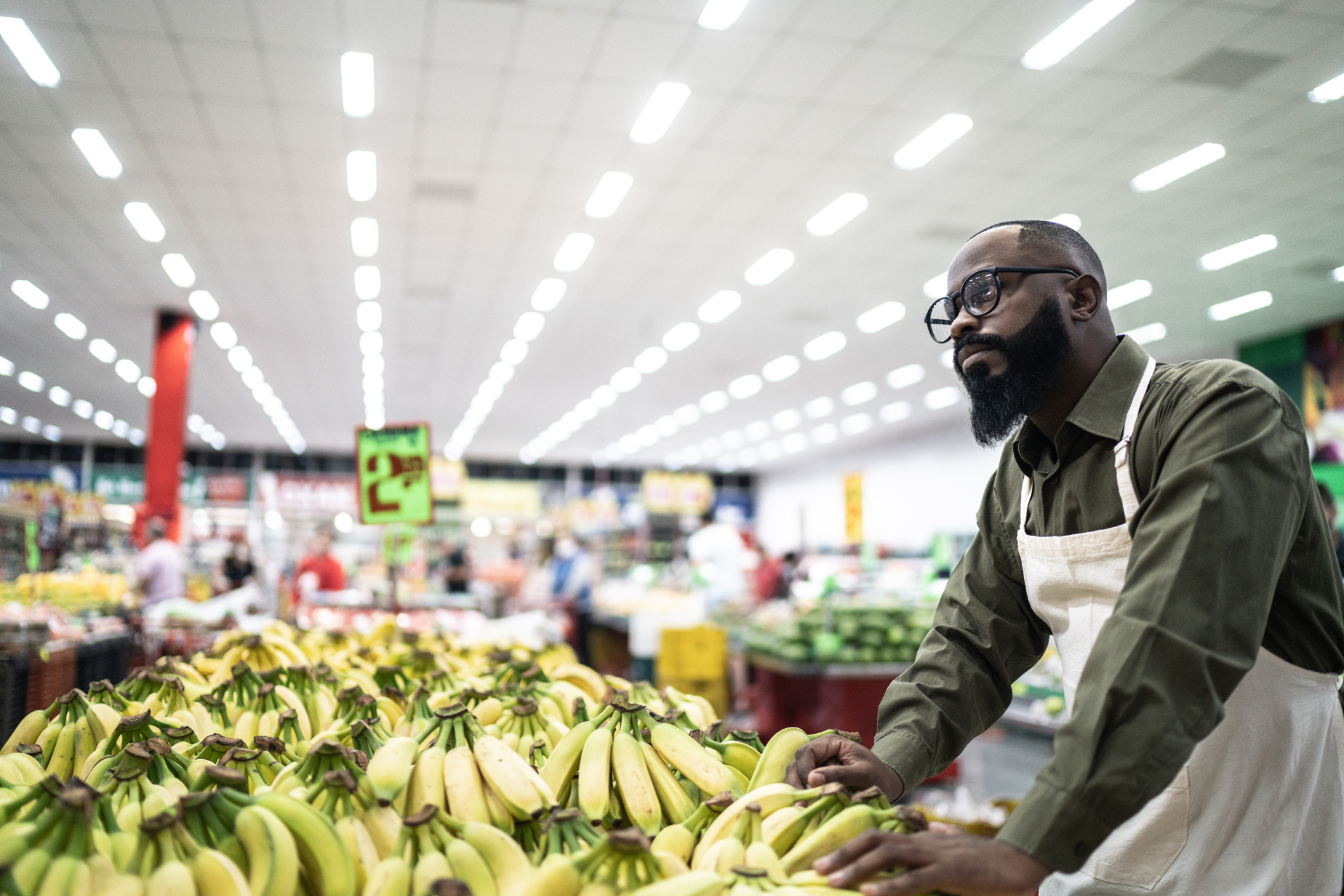 Worried employee working at supermarket