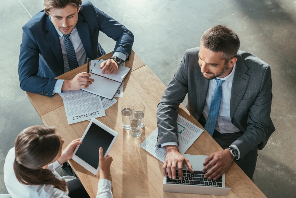businessmen discussing a contract businessmen discussing a contract