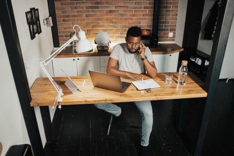 Working from Home A lawyer sits at his home office, focused on his work.