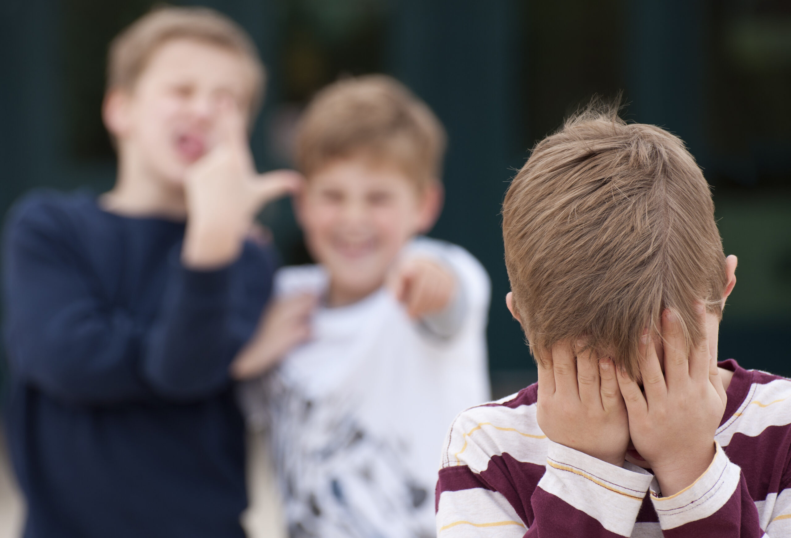 Elementary Student Hides His Face While Being Bullied