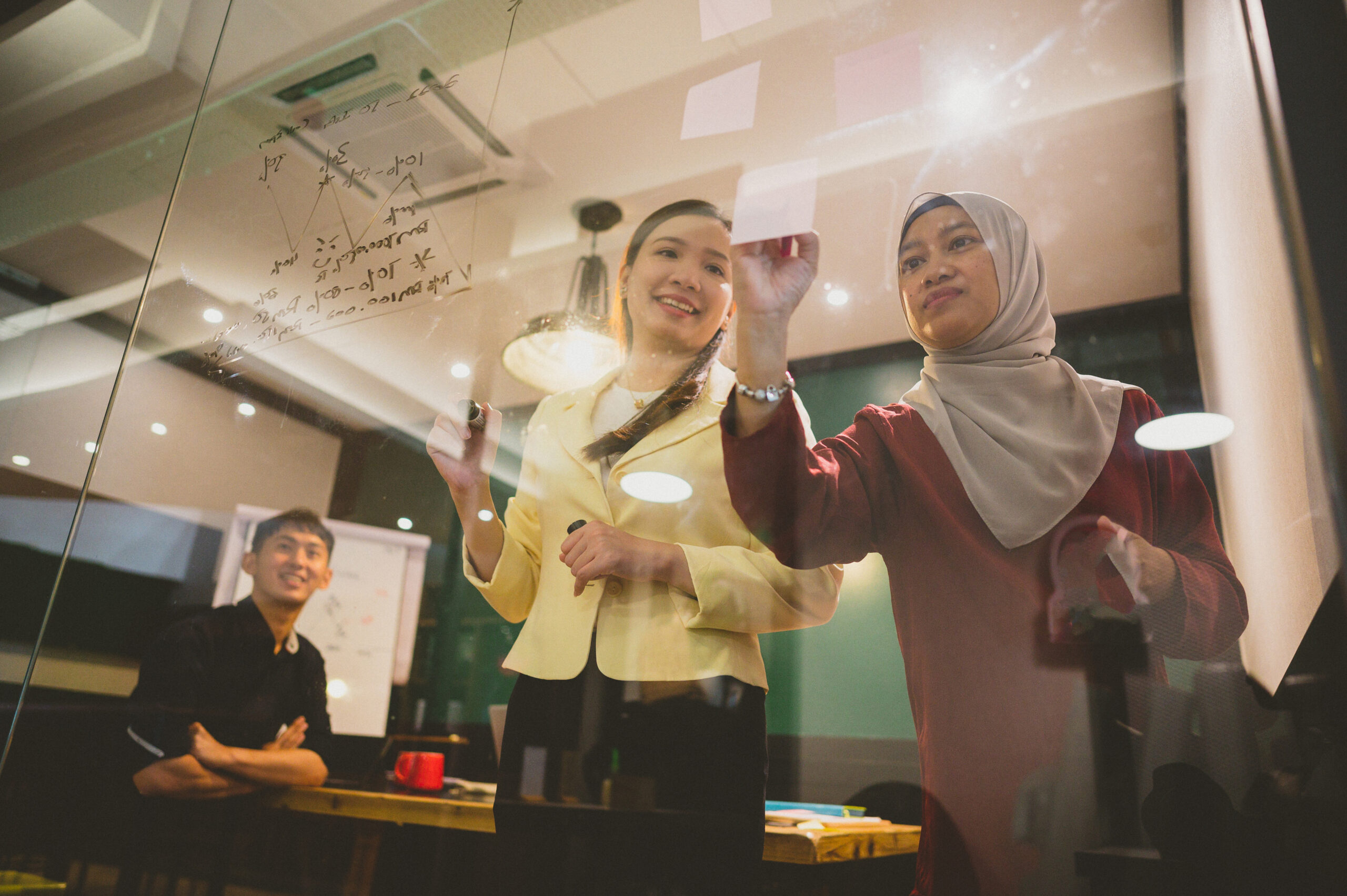 An Asian businesswoman presenting her ideas for company development