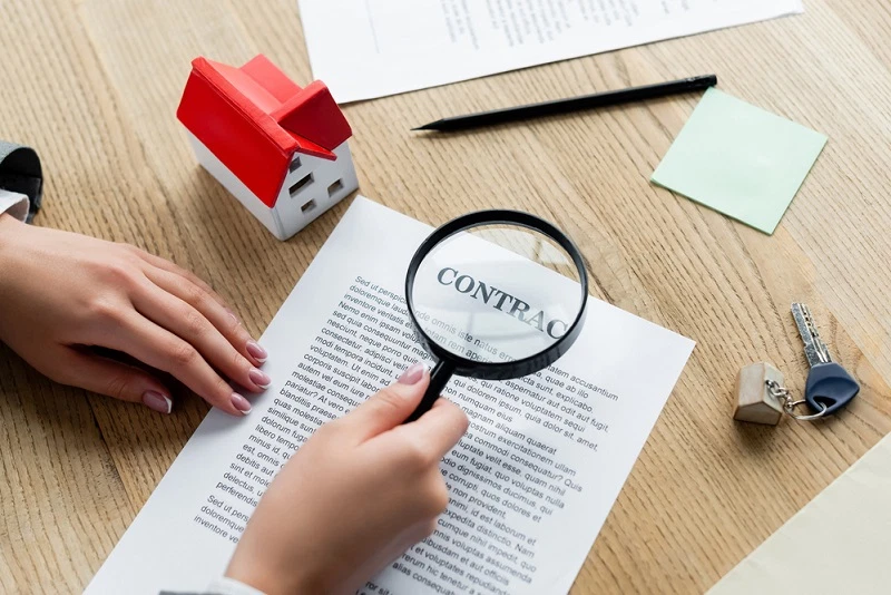 viewing the contract through a magnifying glass
