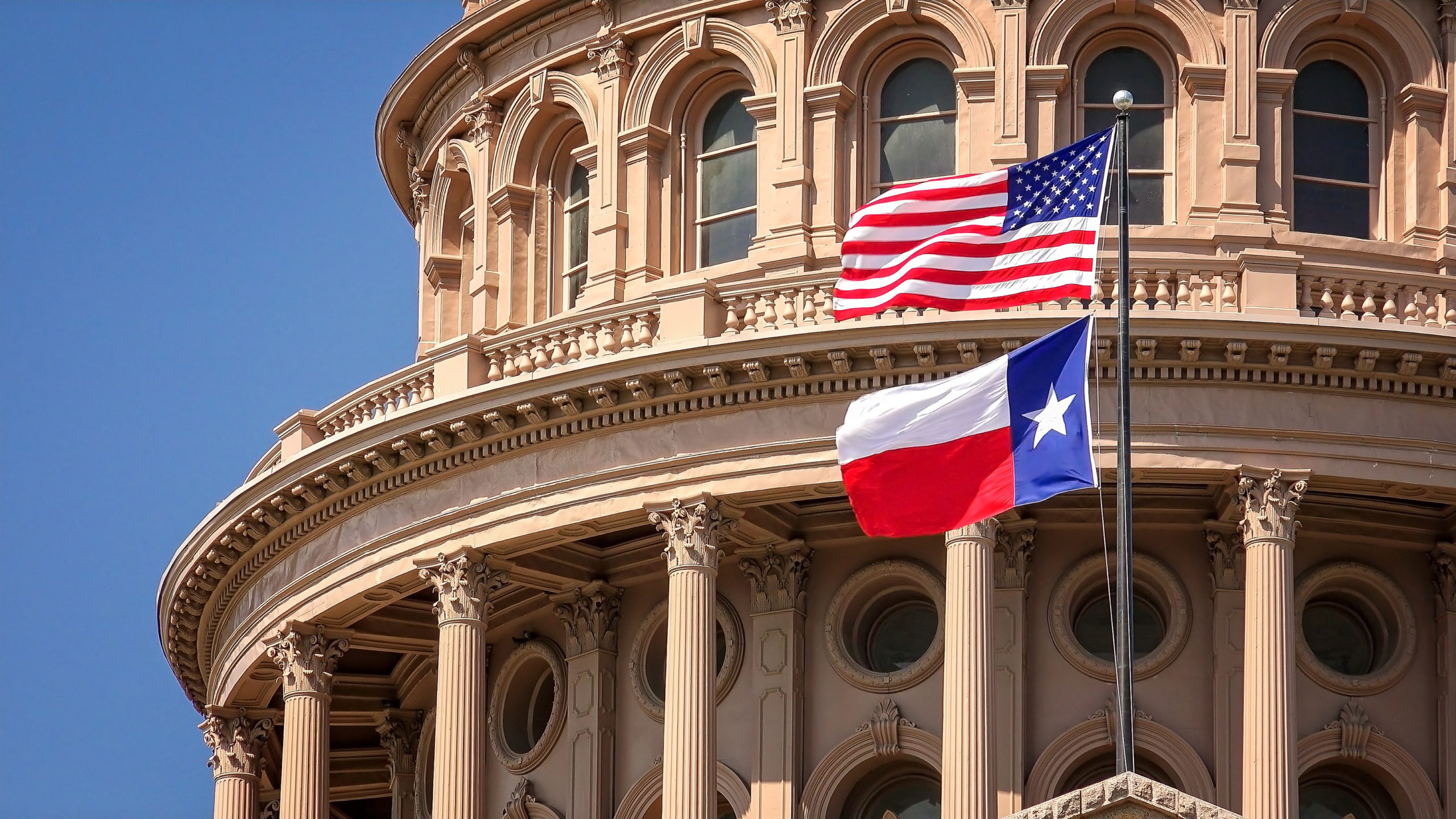 Texas_Austin capital with US and TX flag