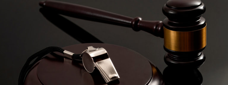 Whistleblower-protection-law-and-freedom-of-information-legislation-conceptual-idea-with-metal-whistle-and-wooden-judge-gavel-on-dark-background-768x288