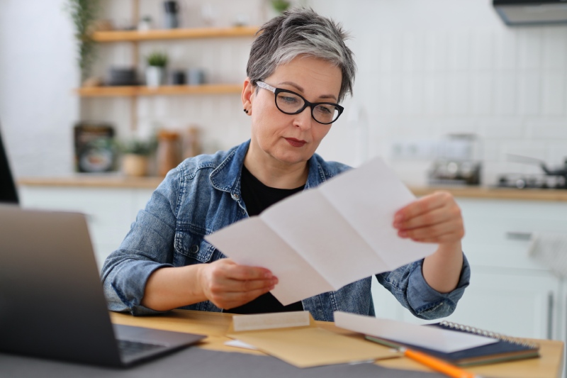 woman reading paper
