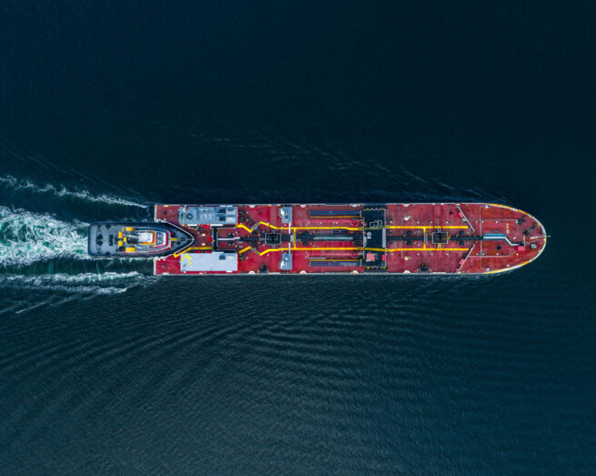 Aerial,View,Of,A,Tug,Boat,Pushing,A,Barge,Carrying