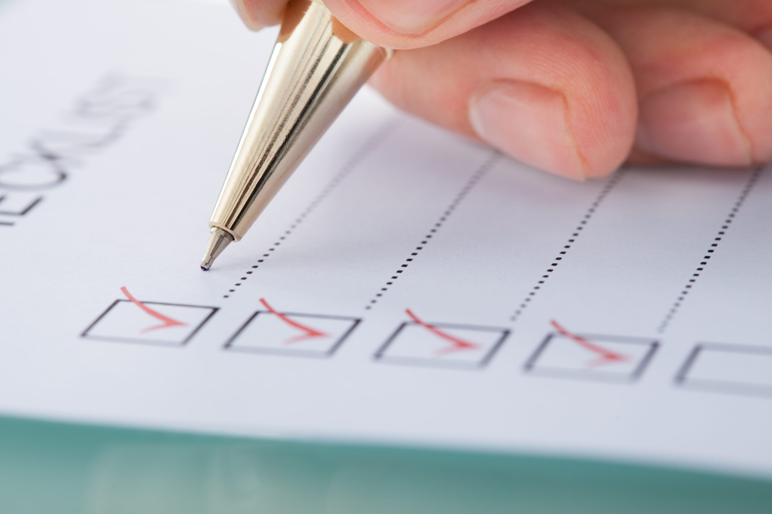 Cropped,Image,Of,Businessman,Preparing,Checklist,At,Office,Desk