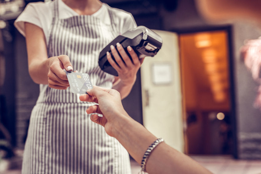 Close up of a debit card being in use