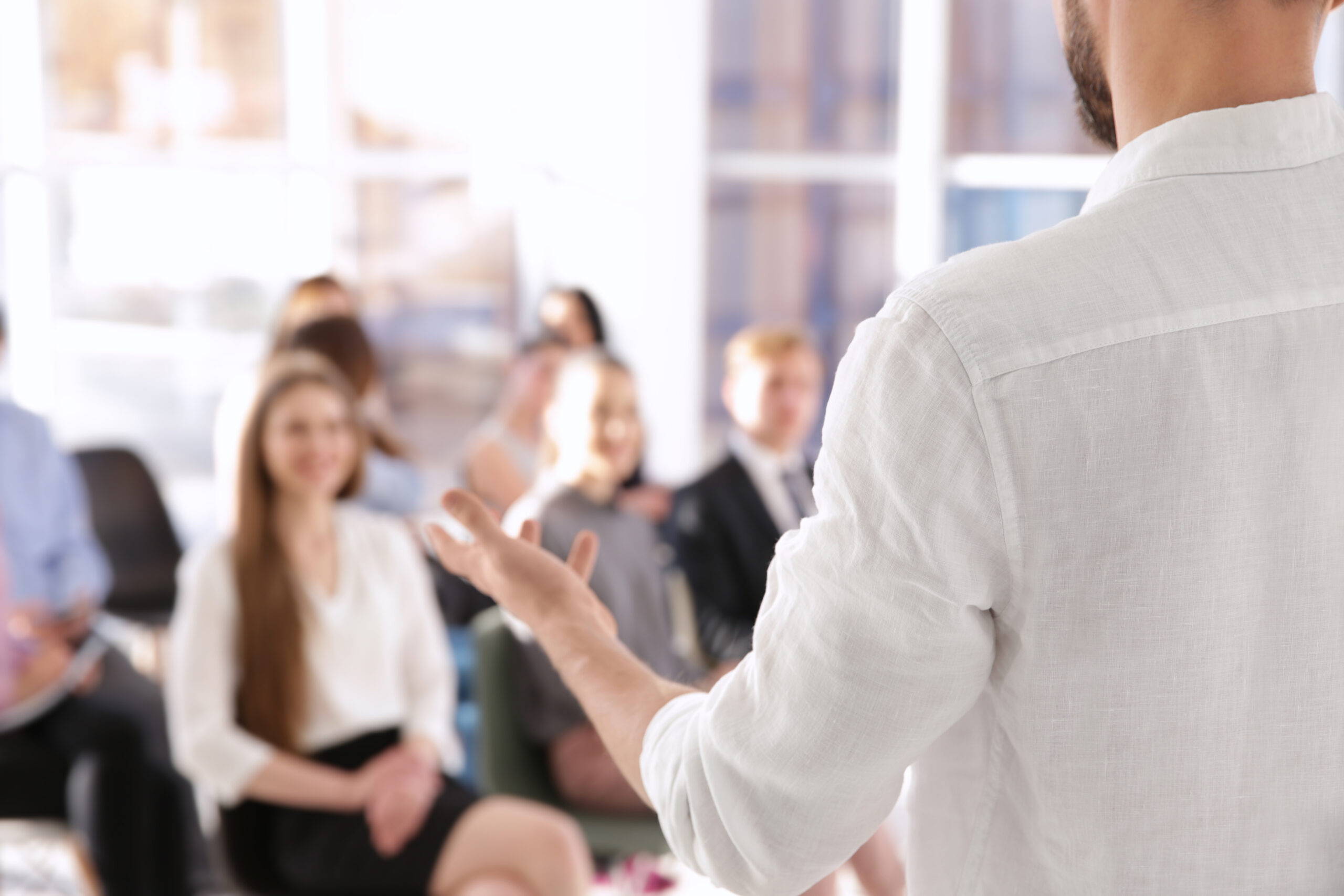 Misc_Business trainer giving presentation to group of people