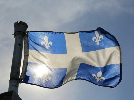 Quebec flag in the beautiful city of Montreal, Quebec, Canada.