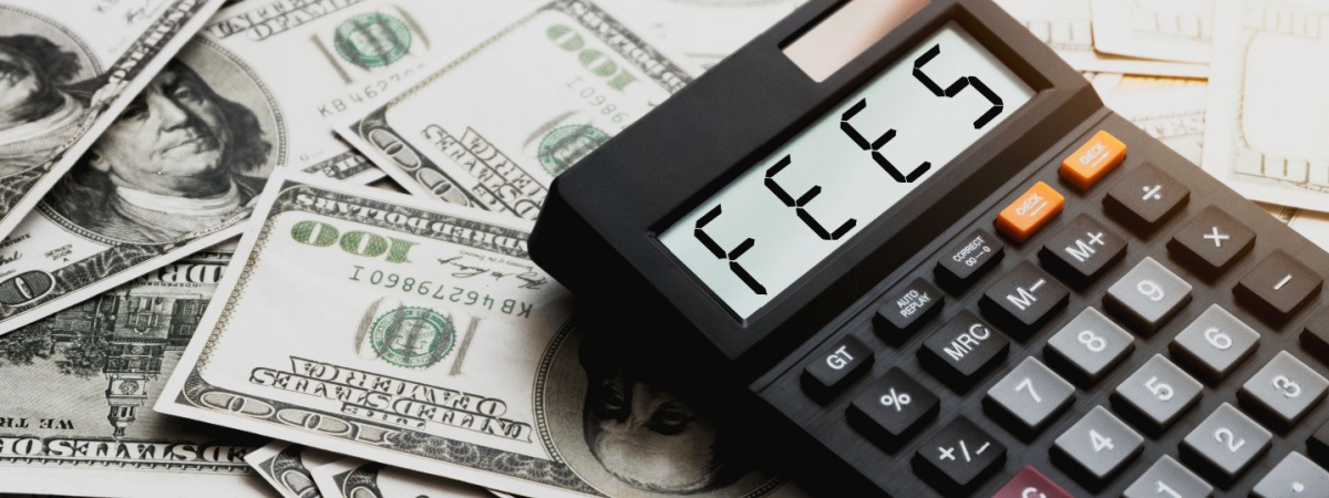 Calculator with the word FEES on the calculator placed on the dollar-Shutterstock_2222079121
