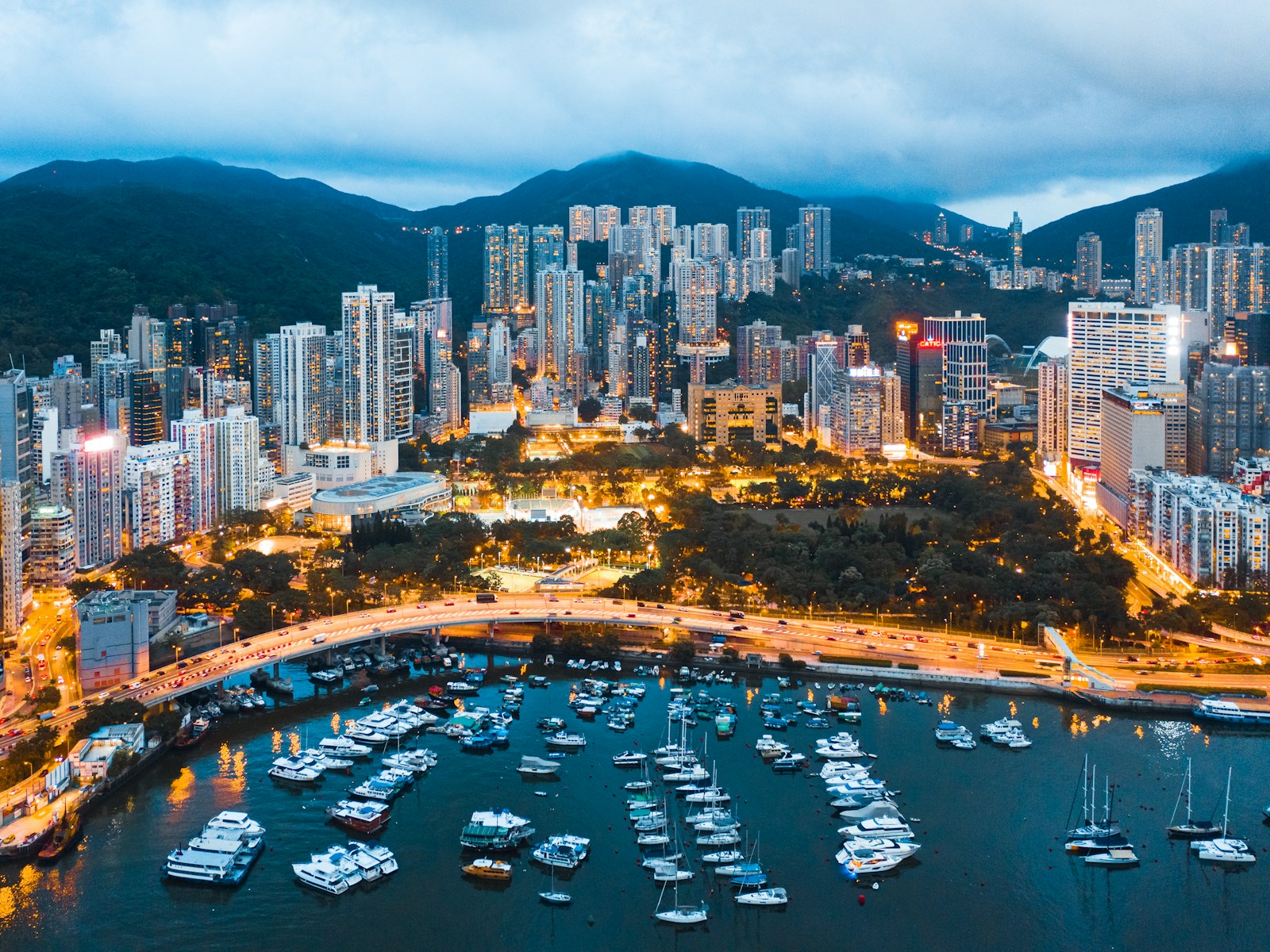 Hilly Cityscape of the Victoria Harbour region of Hong Kong during a blue sunset