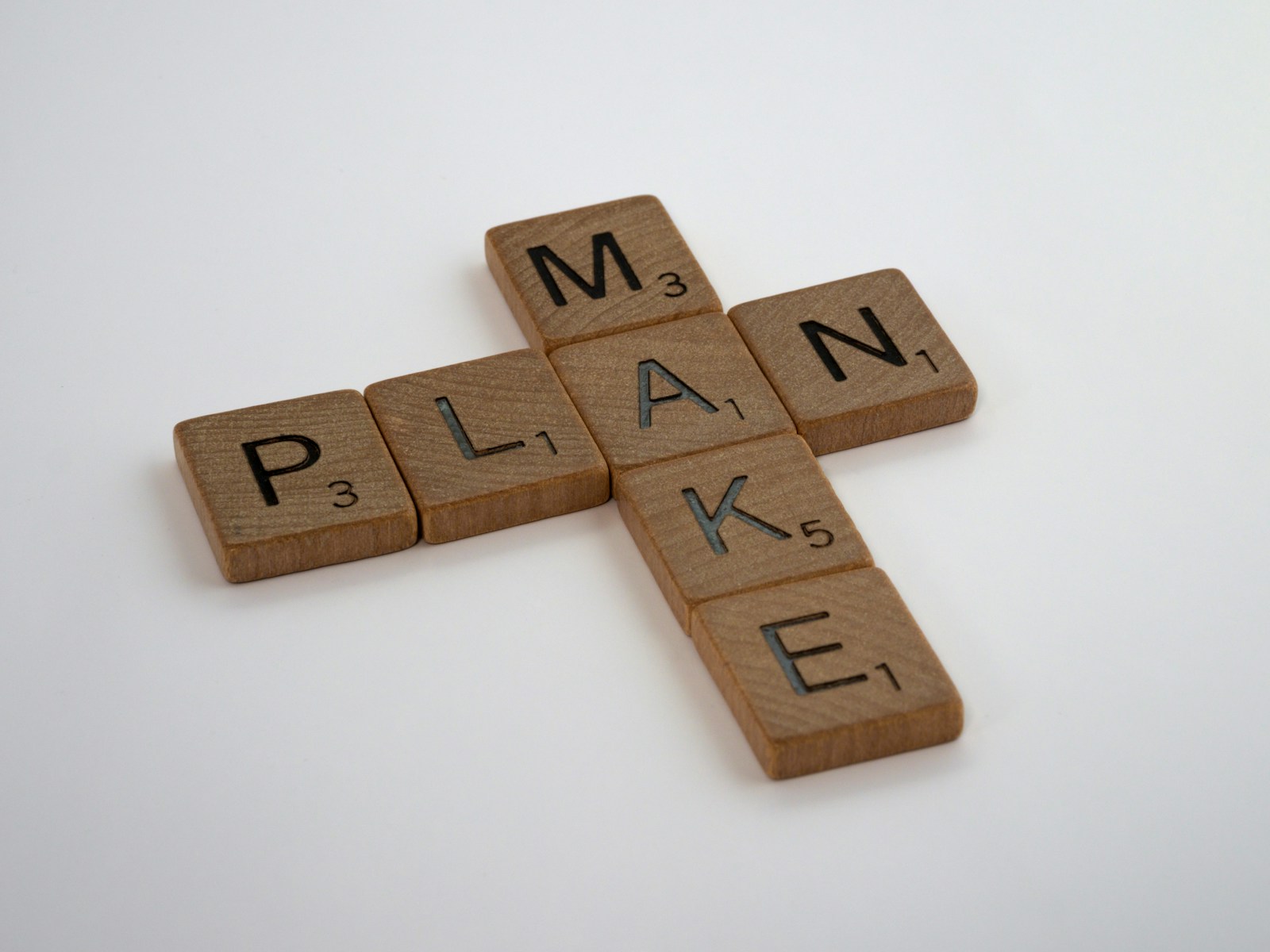 scrabble, scrabble pieces, lettering, letters, wood, scrabble tiles, white background, words, quote, make, plan, just do it, act, do something,