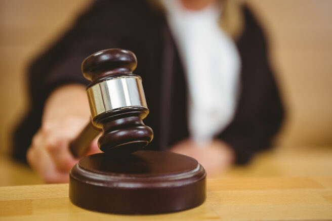 Hand,About,To,Bang,Gavel,On,Sounding,Block,In,The