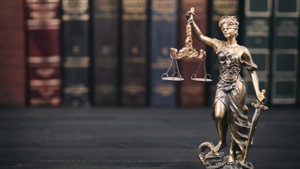 lady justice and law books