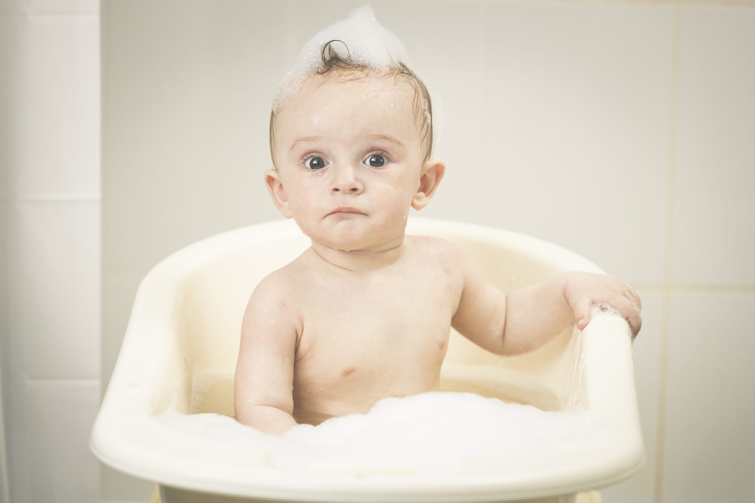 Toned,Portrait,Of,Adorable,Baby,Boy,Having,Bath,Time