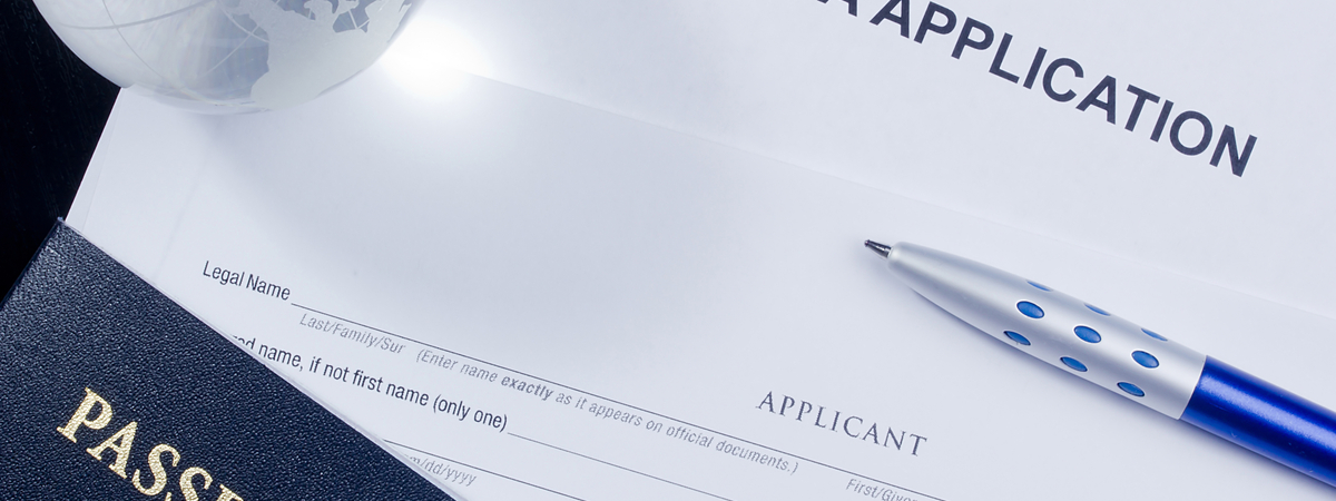 Directly above photograph of an application for a visa.