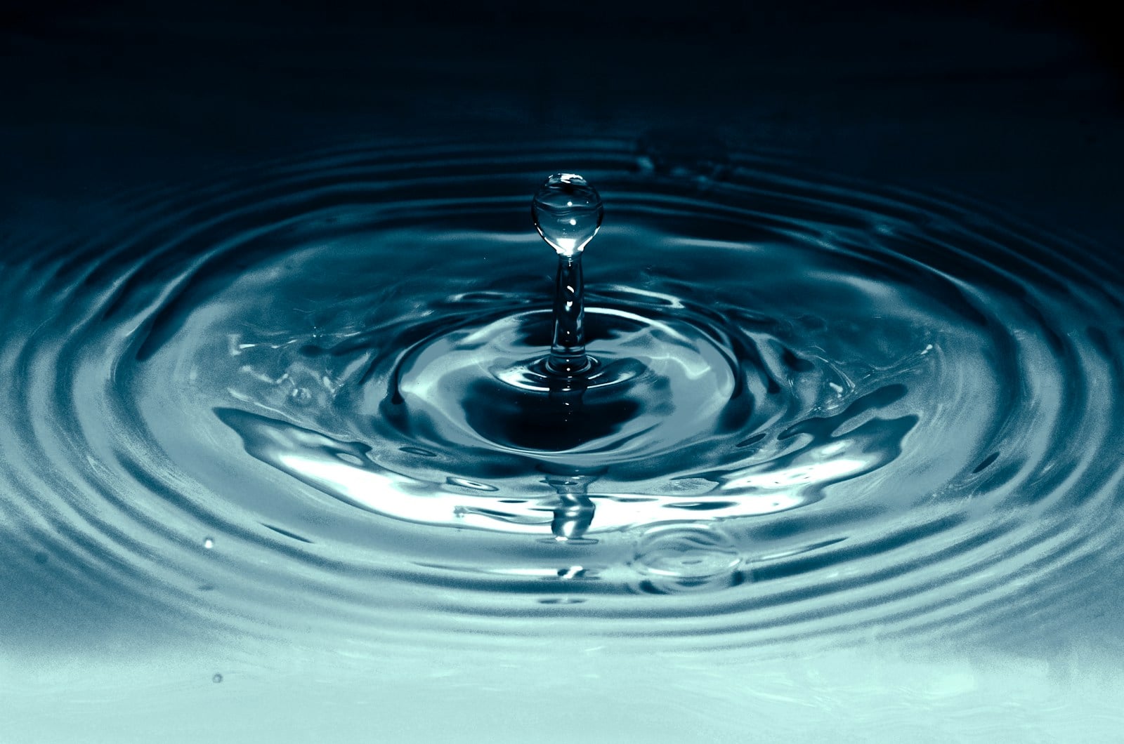 Water droplet in shallow tank