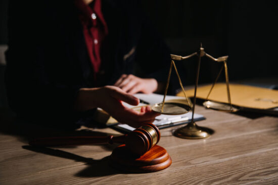 Justice and law concept.Male judge in a courtroom with the gavel