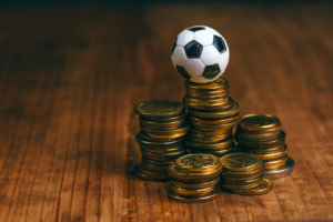 Football on pile of coins
