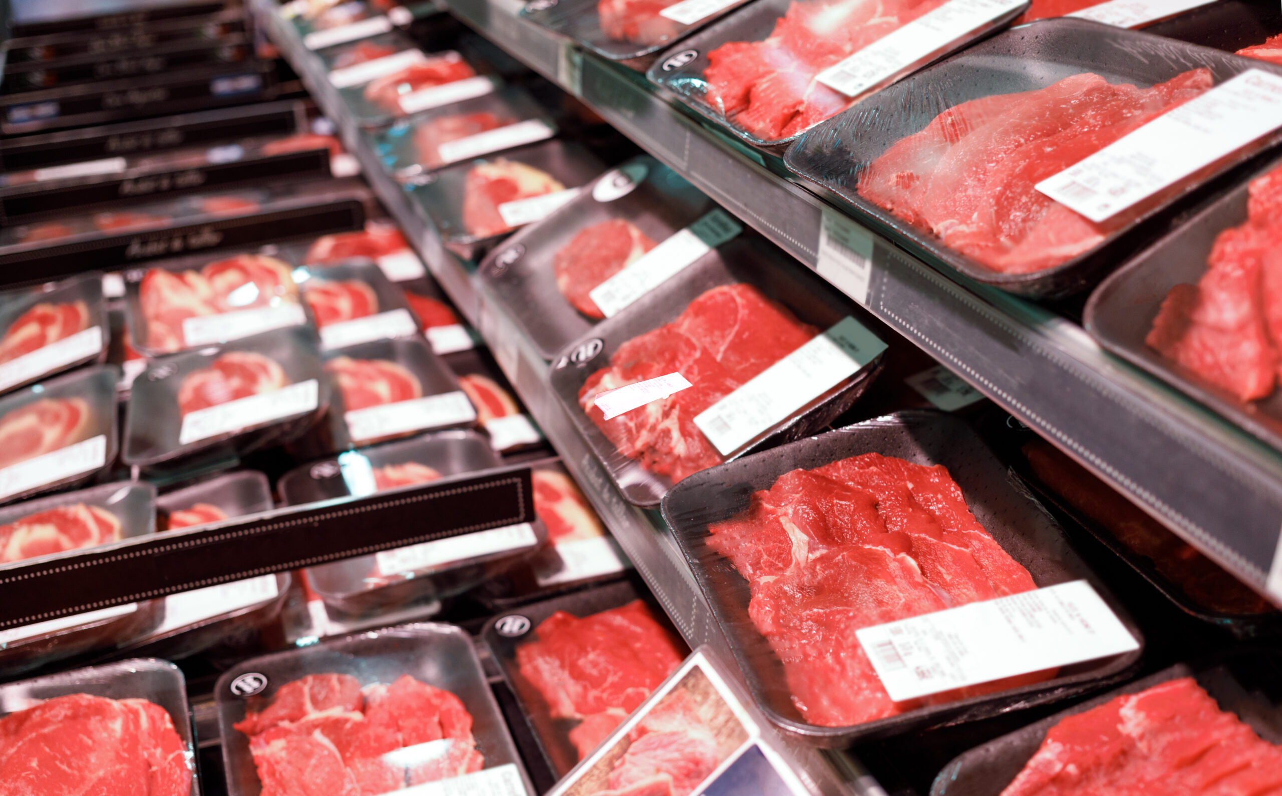 Showcase meat raw products in a supermarket
