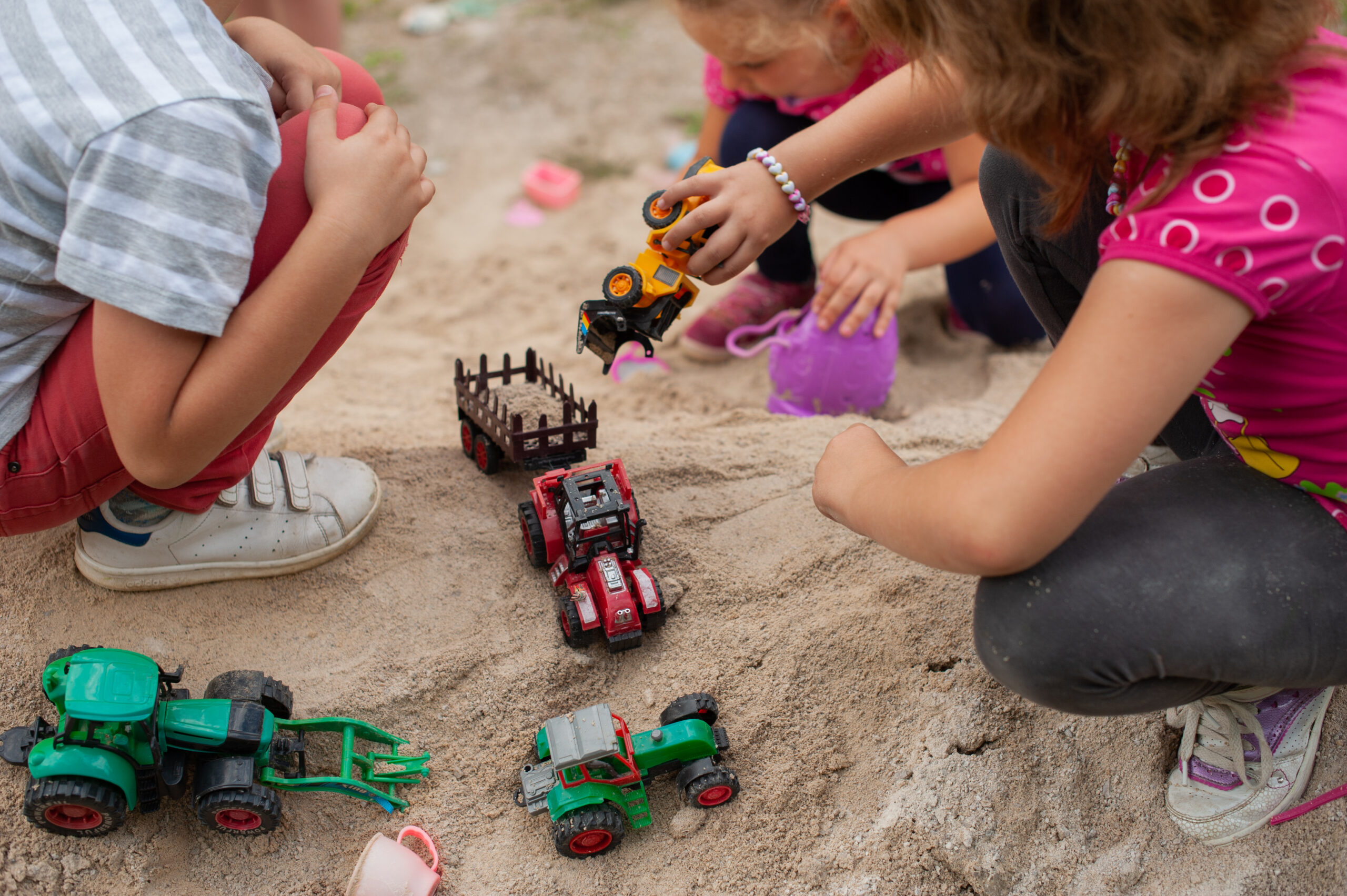 Group,Of,Kids,Playing,Outdor,In,Sand,With,Plastic,Toys