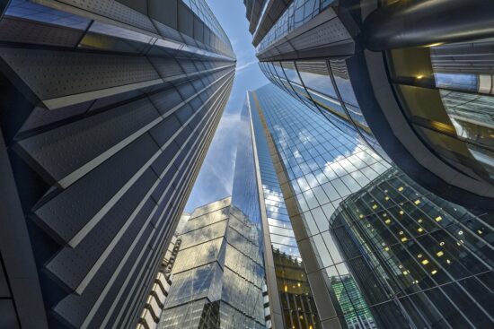 Low angle view looking down Lime Street to Lloyds of London Building, The Scalpel Building, Willis Building and The Leadenhall Building in the City of London UK