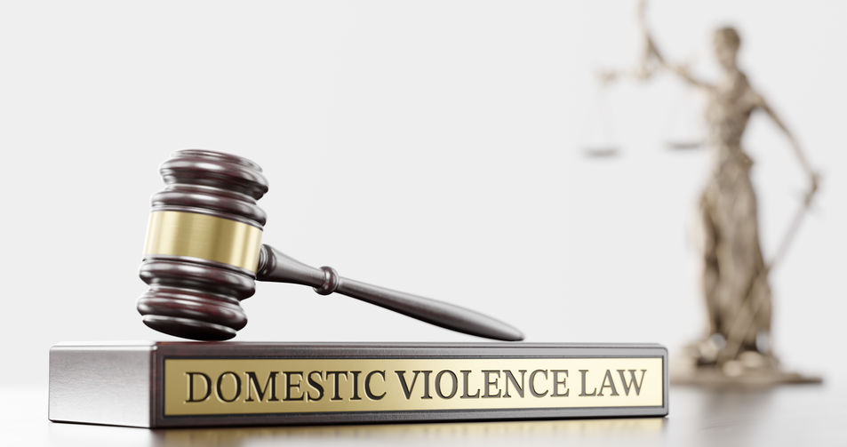 Domestic violence law: Judge's Gavel as a symbol of legal system, Themis is the goddess of justice and wooden stand with text word